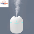 300Ml Mini Air Humidifier Ultrasonic Aroma Essential Oil Diffuser with USB cable releasing mist, perfect for home or car use.