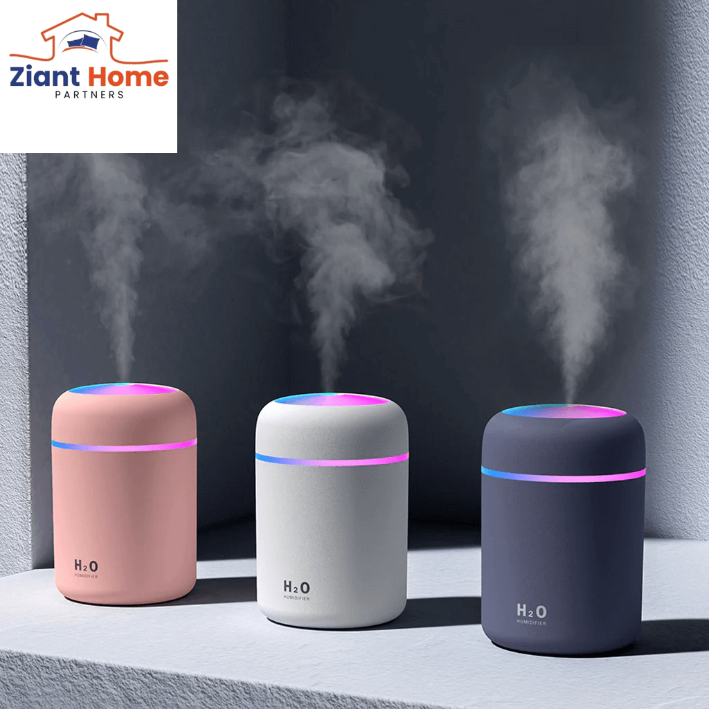 Three 300ml mini air humidifiers ultrasonic aroma essential oil diffusers in pink, white, and dark blue with mist, USB powered.